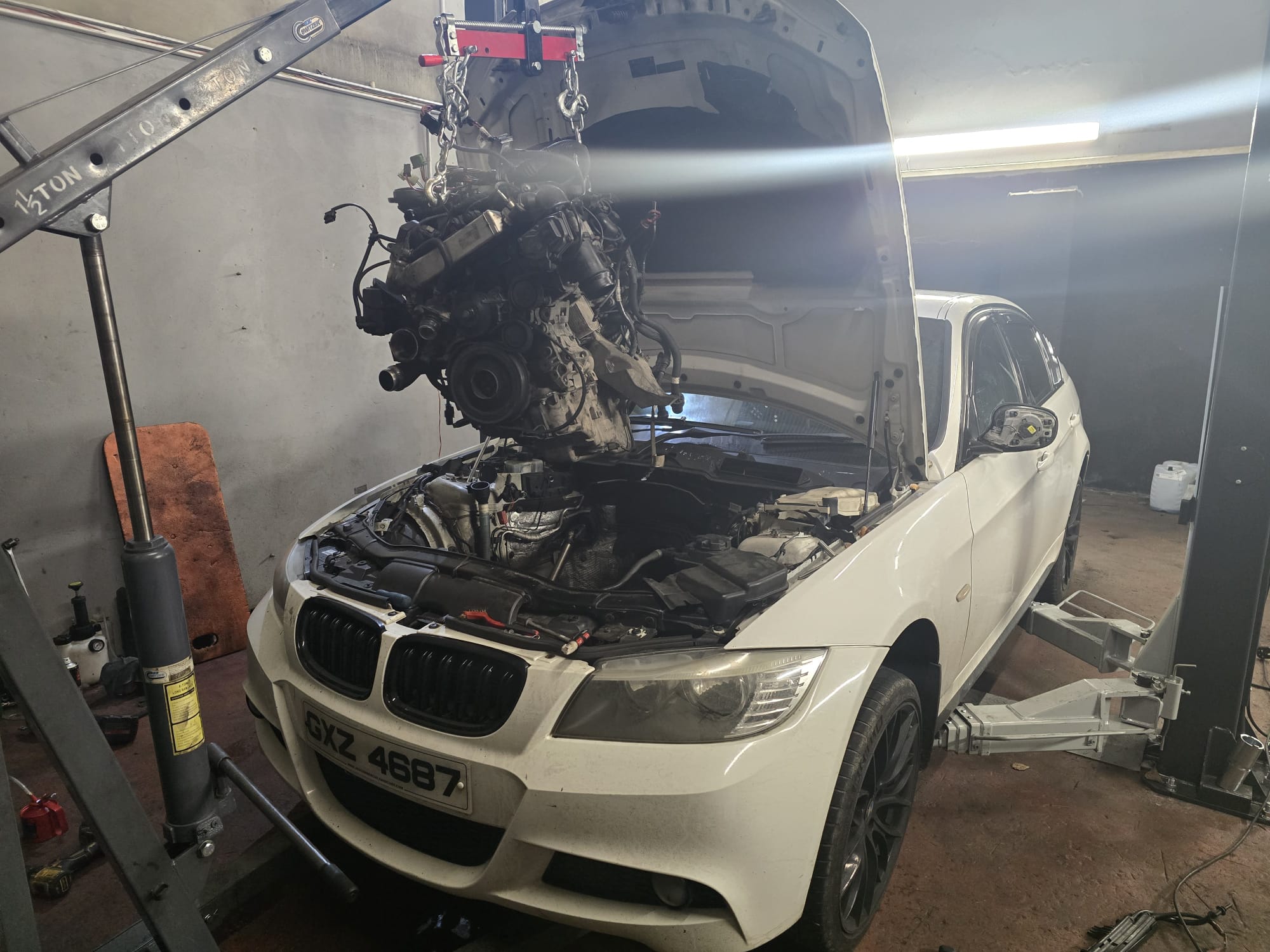 Mechanic working on a BMW engine